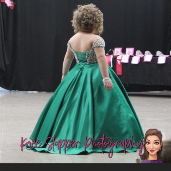 Tiffany size 10. Corset back. It has been hemmed however it can be let out.
